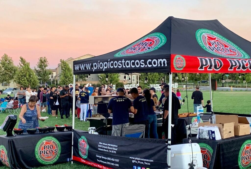 Pio Pico's Tacos team serving an outdoor celebration